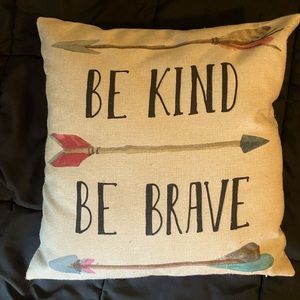 A home decor pillow that is 18x18 inch. It says “Be kind Be brave”.